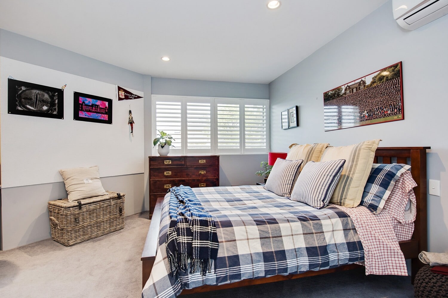 Timber plantation shutters installed in Adelaide living room with louvres tilted for afternoon light