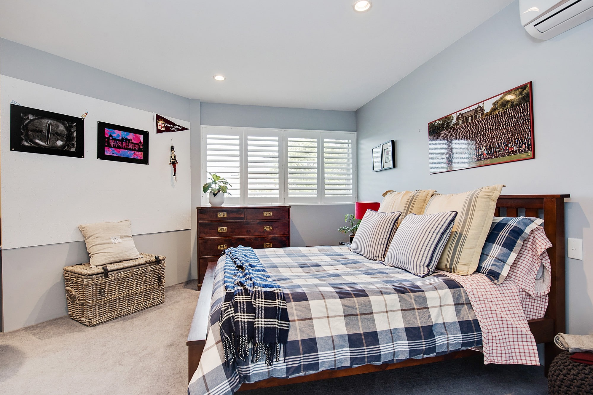 Timber plantation shutters installed in Adelaide living room with louvres tilted for afternoon light
