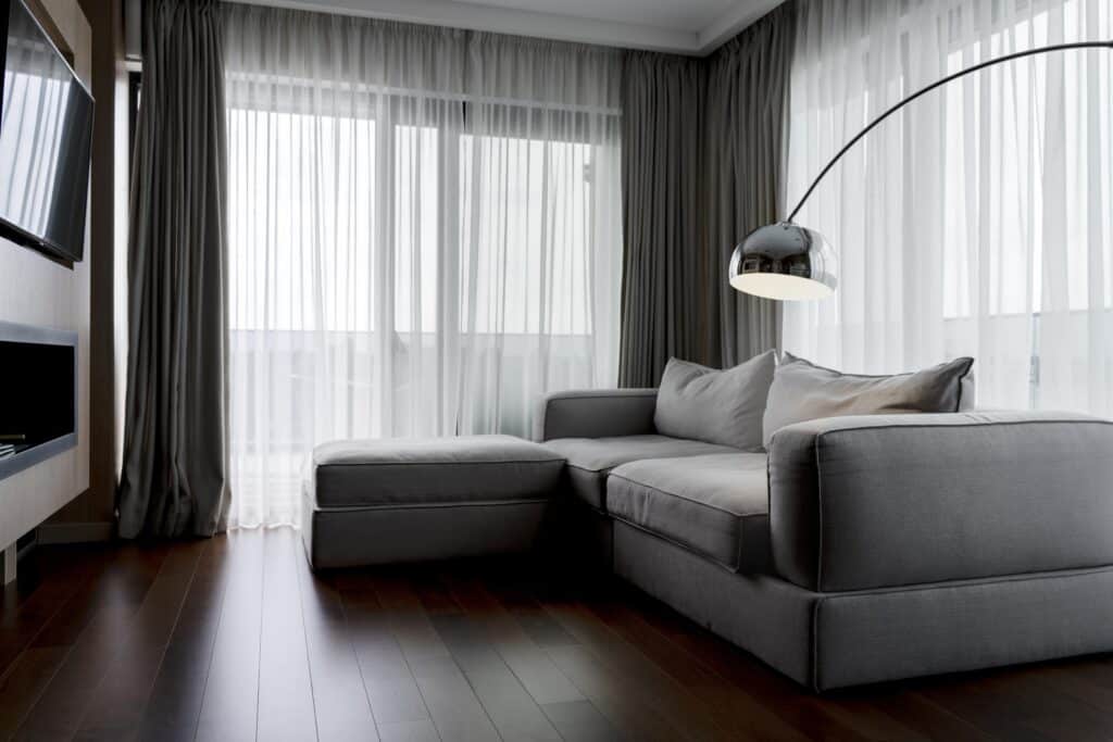 Modern Adelaide living room with custom grey blockout and sheer curtains