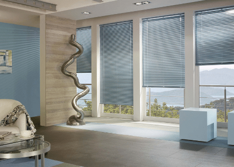 Blue aluminium Venetian blinds in a stylish living room with large windows