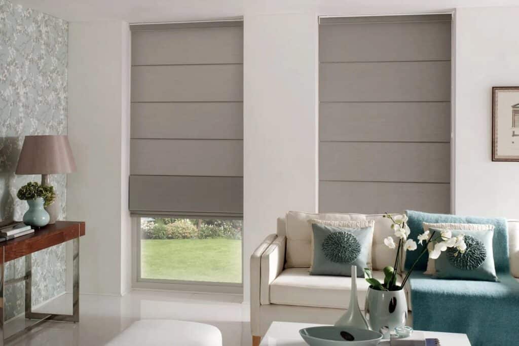 Roman blinds in Adelaide home living room – modern grey fabric blinds paired with contemporary décor.