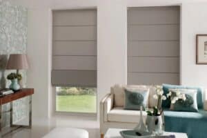 Roman blinds in Adelaide home living room – modern grey fabric blinds paired with contemporary décor.
